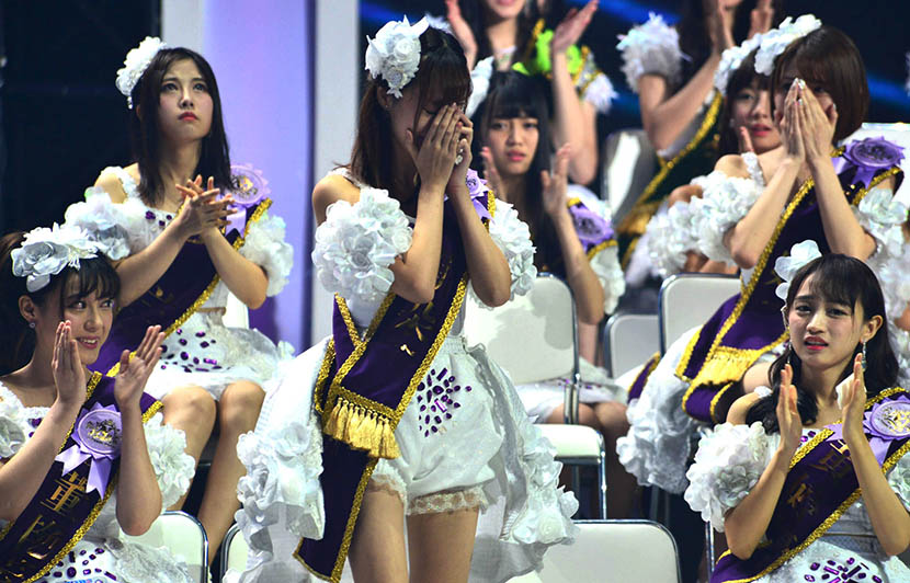 Members of SNH48 react during the final of the second SNH48 Idols Annual Popularity Contest, July 25, 2015. Shen Chunchen/IC