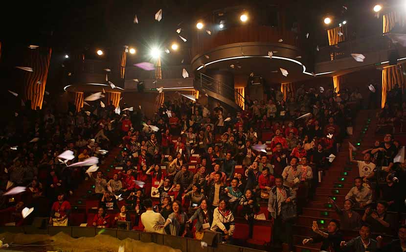 The audience throws paper planes into the air during Speak Out, a public forum on LGBT issues, at Jinsha Theater in Chengdu, Sichuan province, Oct. 15, 2016. Courtesy of Milks Friends