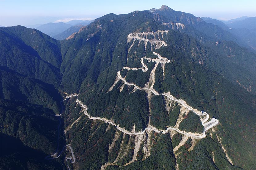 An aerial photo shows the road built on Shikengkong Mountain in the Nanling National Nature Reserve, Guangdong province, Dec. 6, 2016. Yang.W/Greenpeace for Sixth Tone