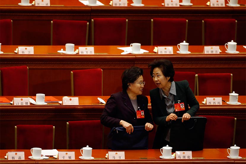 Female delegates talk during the closing ceremony of the Chinese National People’s Congress at the Great Hall of the People in Beijing, March 13, 2014. Kim Kyung-Hoon/Reuters/VCG