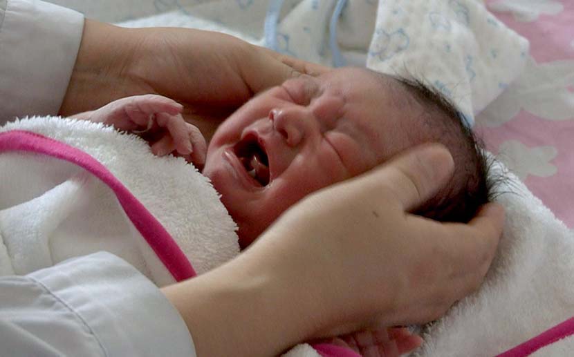 A still from ‘This Is Life’ shows a crying newborn baby.