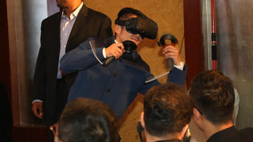 Boxer Zou Shuming experiencing virtual reality technology during a press conference at the 6th Beijing International Film Festival, April 19, 2016. Courtesy of The Filman Investing Management Co. Ltd., or ‘Filman Group.’