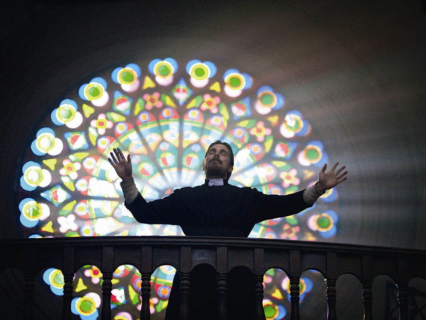 A still frame shows Christian Bale posing as a priest in ‘The Flowers of War.’ VCG