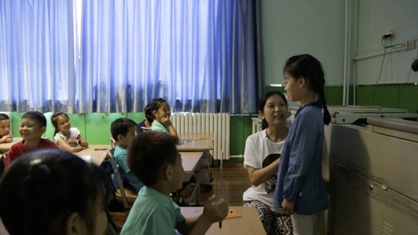 A teacher pretends to make sexual advances on a student during a role-playing activity at a Girls’ Protection workshop in Beijing, June 2016. Han Meng/Sixth Tone