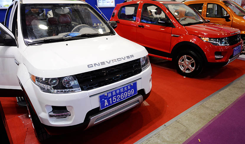 Electric cars, including these Land Rover lookalikes, are on display at a ‘new energy’ vehicle show in Jinan, Shandong province, March 11, 2016. Wenlu/VCG