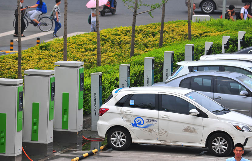 Charging stations line a parking lot in Zhongguancun, Beijing, July 22, 2016. Fan Jiashan/VCG