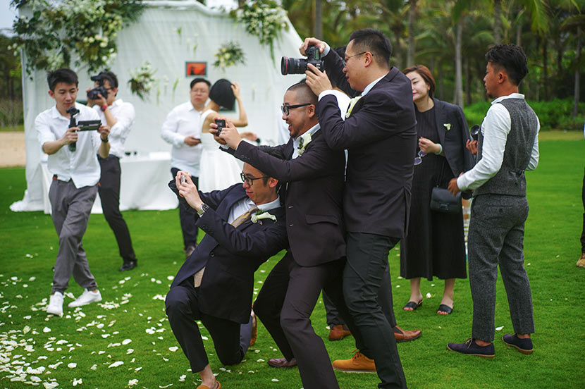 Guo Kun (front right) photographs a wedding ceremony in Shanghai, April 12, 2017. Courtesy of Guo Kun