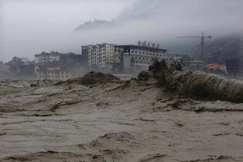 Heavy flooding hits the old town of Beichuan Qiang Autonomous County, Sichuan province, July 9, 2013. By Yang Weihua