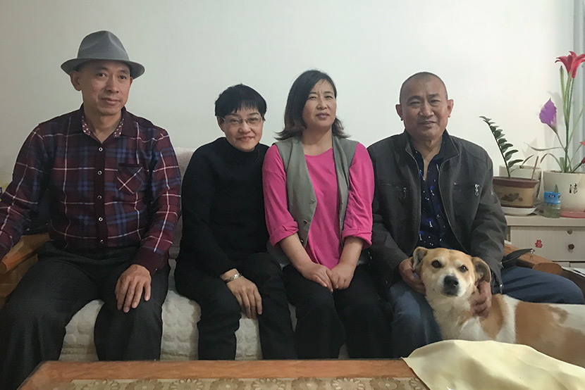 From right to left: Wang Guitong, Wang’s wife, Chen Yumei, and Chen’s husband pose for a photo in Qingdao, Shandong province, April 27, 2018. Wang Lianzhang/Sixth Tone