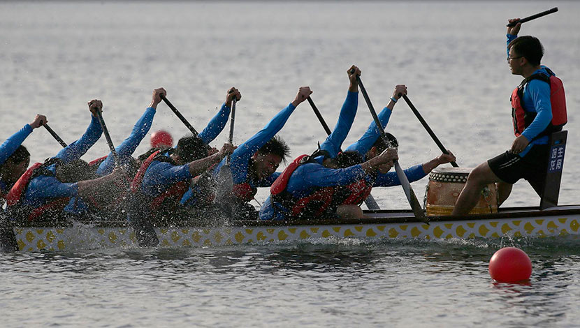 University students participate in a boat race before the  Dragon Boat Festival in Lianyungang, Jiangsu province, June 17, 2018.  Liu Guanguan/CNS/VCG