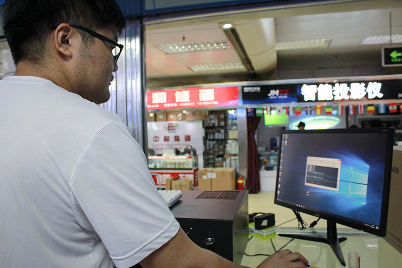 Du Peng at his shop for cryptocurrency mining machines in Huaqiangbei, Shenzhen, Guangdong province, May 28, 2018. Chen Na/Sixth Tone