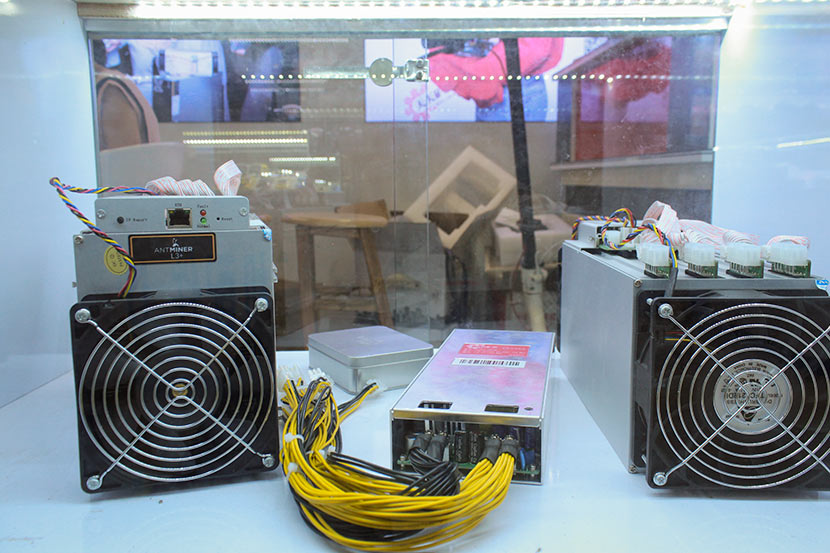 Cryptocurrency mining machines sit in a store’s display case in Huaqiangbei, Shenzhen, Guangdong province, May 28, 2018. Chen Na/Sixth Tone