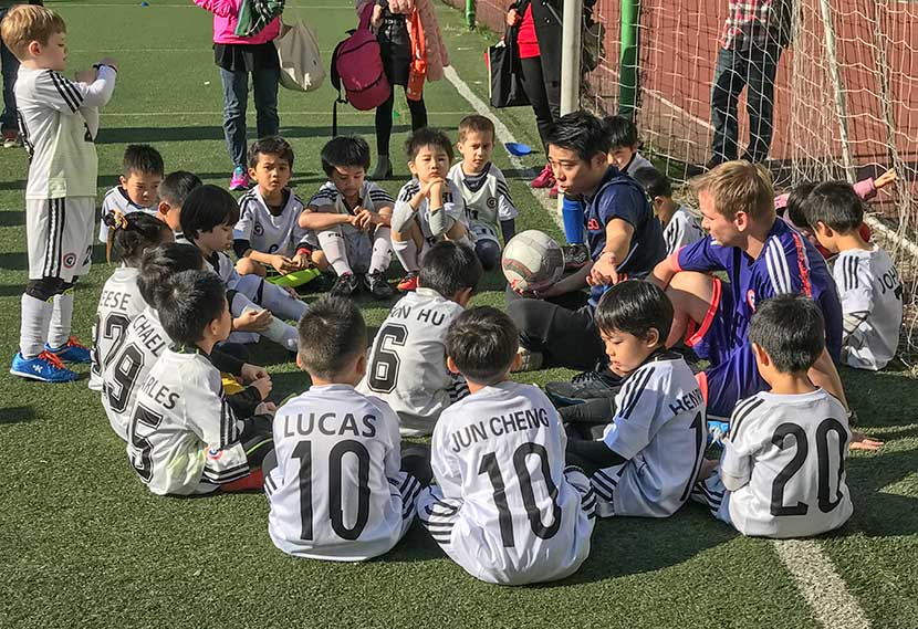 Fang Minfei coaches young soccer players in Shanghai, 2016. Courtesy of Fang Minfei