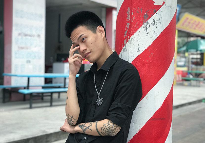 Luo Fuxing poses for a photo in Dongguan, Guangdong province, June 4, 2018. Wang Lianzhang/Sixth Tone
