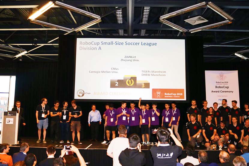 Zhejiang University's team receives their award during RoboCup 2018, a soccer competition for robots held in Montreal, June 22, 2018. Courtesy of ZJUNlict