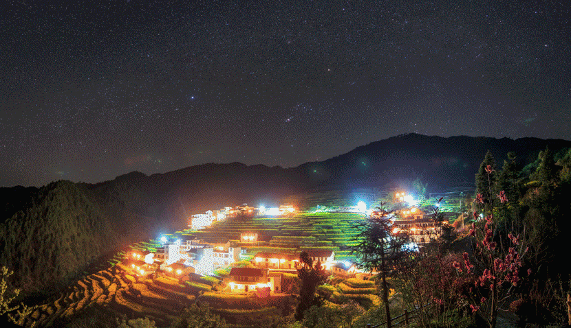 Light pollution from the town of Kaihua dims views of the night skies above Taihui Mountain, Zhejiang province, March 27, 2017. Courtesy of Dai Jianfeng