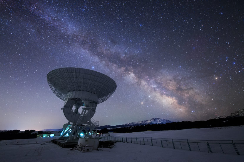 A radio telescope points toward the Milky Way at Xinjiang Astronomical Observatory, Xinjiang Uyghur Autonomous Region, April 12, 2018. Courtesy of Dai Jianfeng
