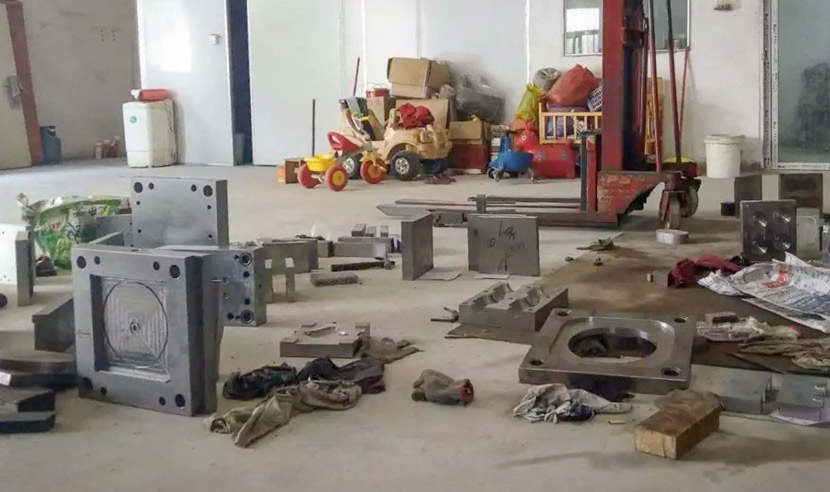 Metal molds clutter the floor of the factory where Liang Chaowei once worked in Shantou, Guangdong province, 2018. Courtesy of Liang Chaowei