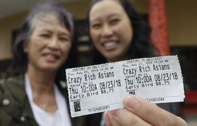 Two women show off their tickets after a screening of ‘Crazy Rich Asians’ in Daly City, U.S., Aug. 23, 2018. Jeff Chiu/IC