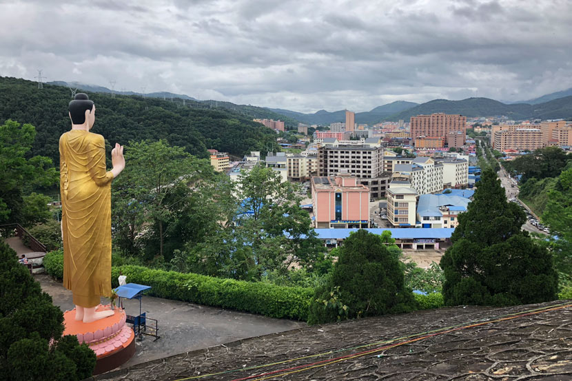 A local temple’s statue overlooks Mong La, Myanmar, July 25, 2018. Shi Yi/Sixth Tone