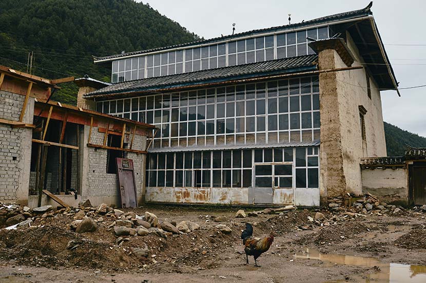 The exterior view of a three-floor house owned by Chumpal’s family in Chugu, Diqing Tibetan Autonomous Prefecture, Yunnan province, July 17, 2018. The family's third dwelling, which is still under construction, is on the left. Wu Huiyuan/Sixth Tone