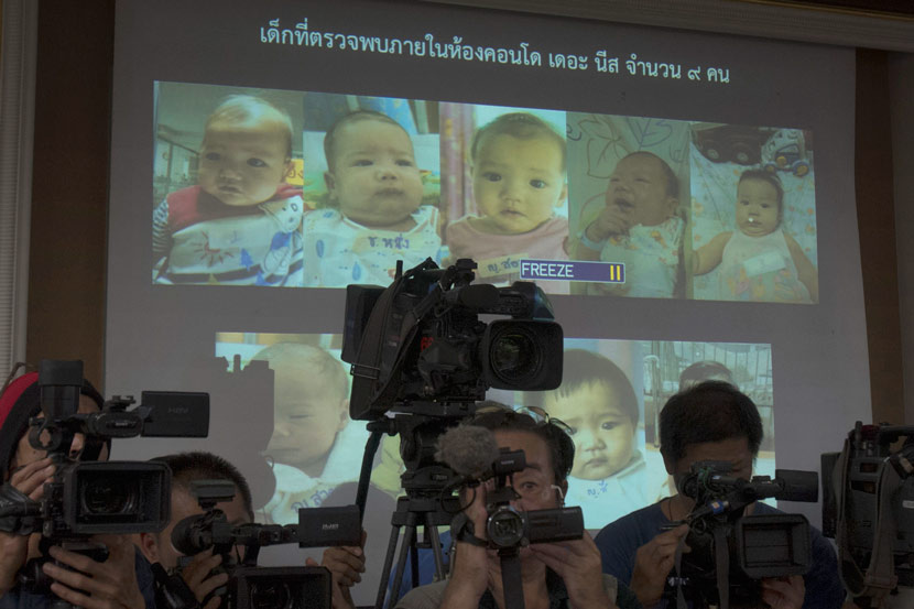 Thailand police display pictures of surrogate babies connected with a surrogacy scandal at the police headquarters in Chonburi, Thailand, Aug. 12, 2014. A multinational investigation found that a 24-year-old Japanese businessman has 16 surrogate babies and an alleged desire to father hundreds more. Sakchai Lalit/AP Photo/IC