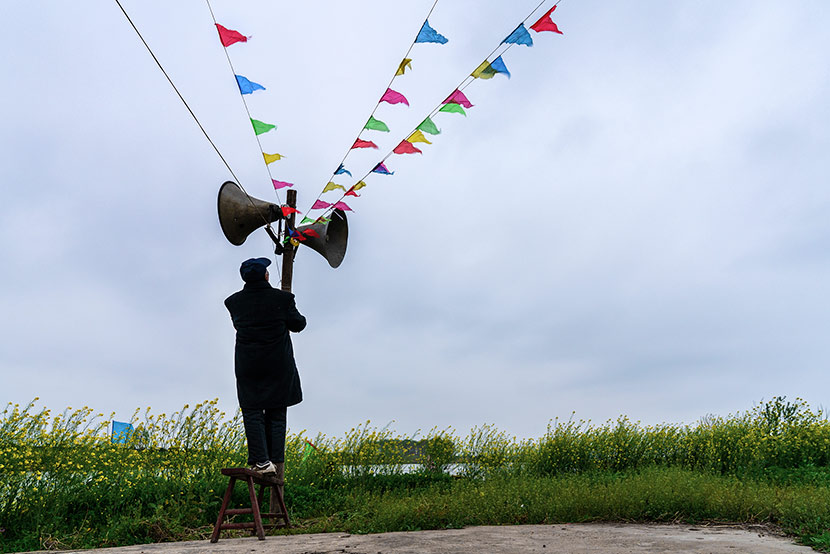 A villager checks the village loudspeakers before a temple fair in Zhouze Village, Xinghua, Jiangsu province, April 5, 2018. Zhou Xiaosong/VCG