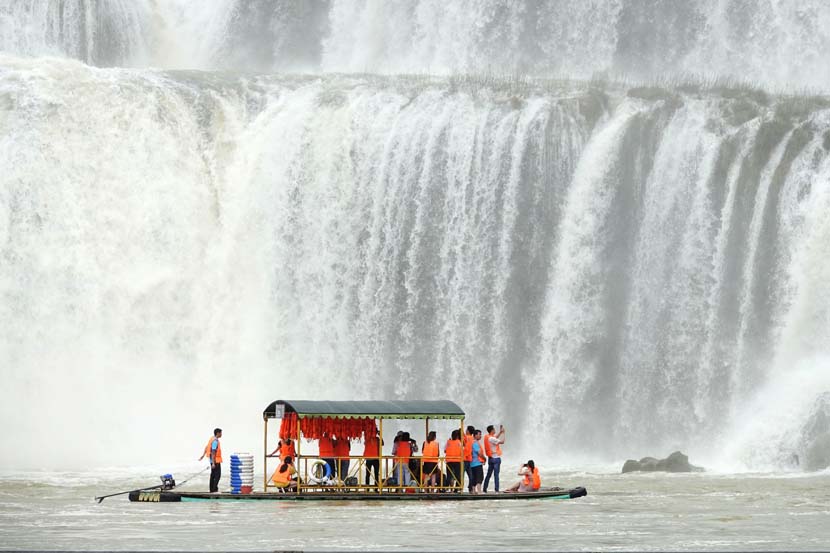 Tourists visit Detian Waterfall in Daxin County, Guangxi Zhuang Autonomous Region, June 11, 2019. Yu Xiangqian/Xinhua