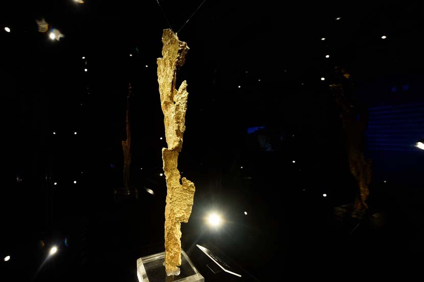 A natural gold formation measuring 20.4 inches long is exhibited in Hangzhou, Zhejiang province, June 25, 2019. The gold piece, nicknamed Thunder, was discovered in Australia and weighs 7.7 pounds. Long Wei/VCG
