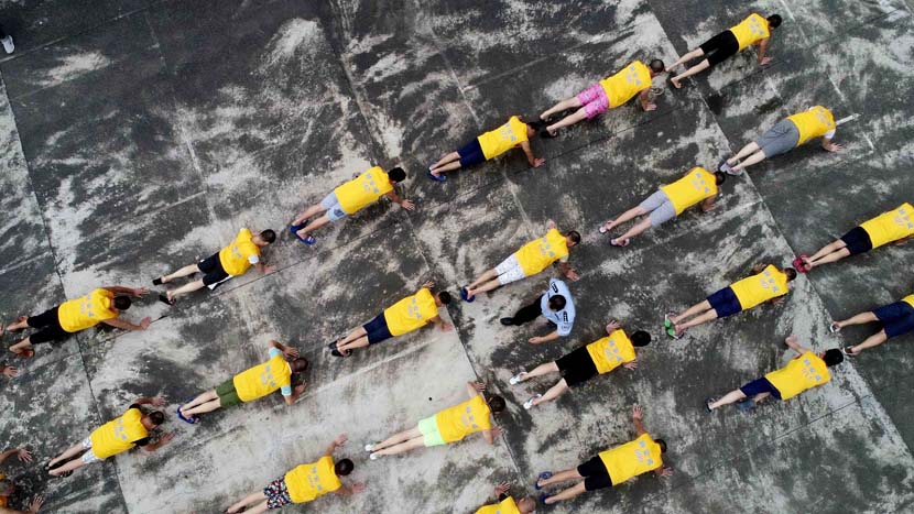 Residents take part in an exercise session at a drug rehabilitation facility on International Day Against Drug Abuse and Illicit Trafficking in Liuzhou, Guangxi Zhuang Autonomous Region, June 26, 2019. Tan Kaixing/VCG