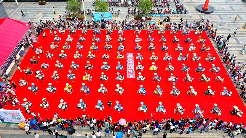 An aerial view of about 100 children playing drums to celebrate International Children’s Day at the Wuxi Binhu Wanda Plaza, Wuxi, Jiangsu province, June 1, 2019. Yi Wei/VCG