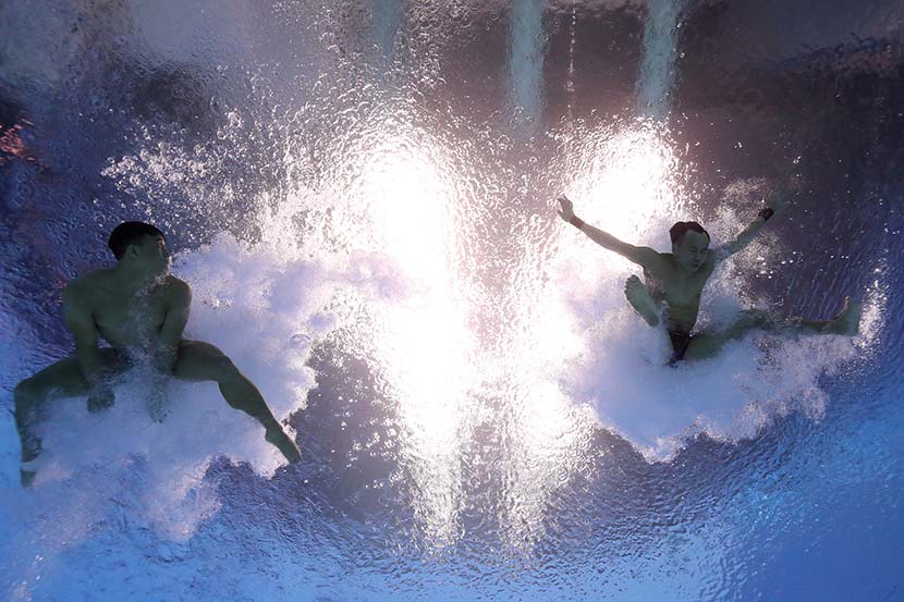 China’s Yuan Cao and Siyi Xie compete in the men’s 3-meter springboard synchro finals at the 18th FINA World Championships in Gwangju, South Korea, July 13, 2019. Quinn Rooney/Getty Images/VCG
