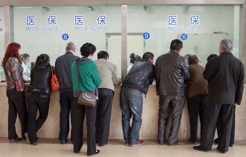 People wait to check in to a hospital in Sanmenxia, Henan province, Oct. 24, 2012. Sun Meng/VCG