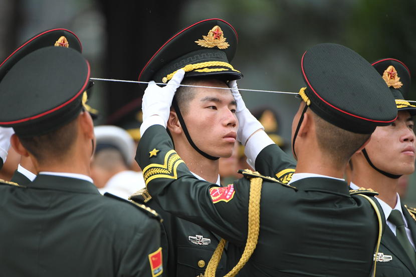 Members of the military honor guard prepare for the welcoming ceremony for Abu Dhabi Crown Prince Mohammed bin Zayed outside the Great Hall of the People in Beijing, July 22, 2019. Greg Baker/AFP/VCG