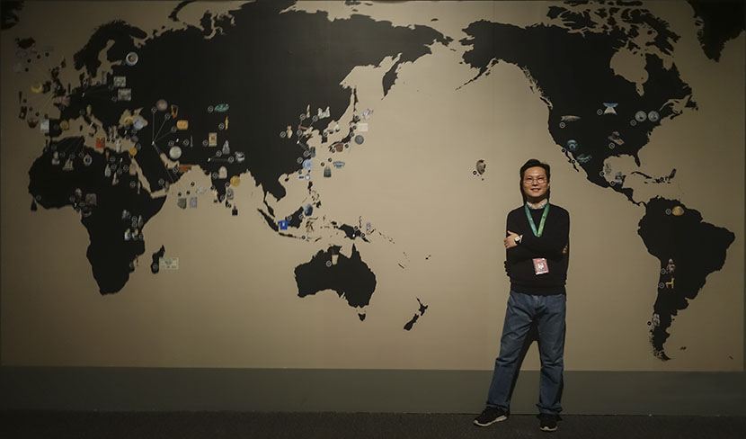Yan Zhi poses for a photo at the ‘A History of the World in 100 Objects’ exhibition at the National Museum of China, Beijing, Feb. 28, 2017. Courtesy of Yan Zhi