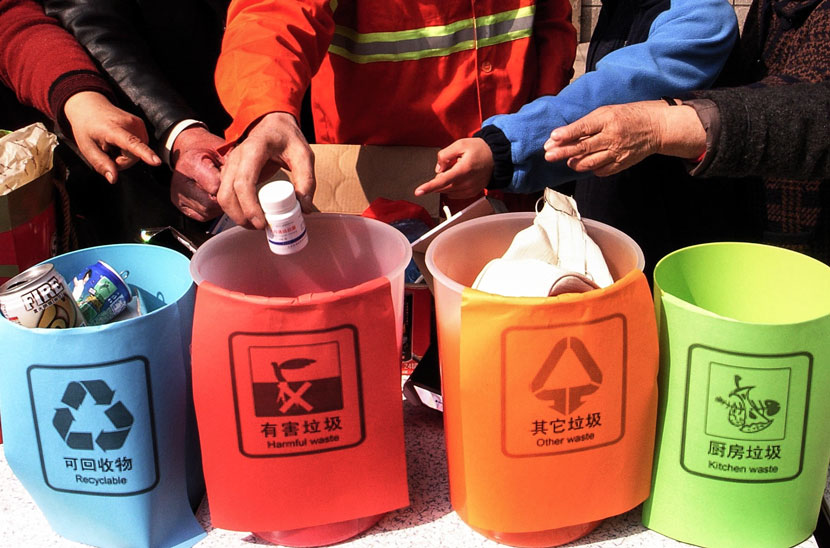Color-coded bins are displayed at an event to promote trash sorting in Hangzhou, Zhejiang province, March 28, 2010. Wu Huang/VCG