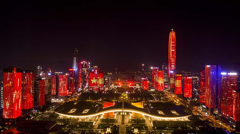 The city skyline turns red as part of a light show to mark the 70th anniversary of the founding of the People’s Republic of China on Oct. 1, 1949, in Shenzhen, Guangdong province, Sept. 20, 2019. VCG