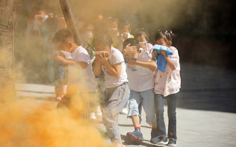 Students take part in a fire drill in Nantong, Jiangsu province, Sept. 18, 2019. The drill was billed as honoring those who died in the country’s war against Japan 80 years ago. Xu Peiqin/VCG