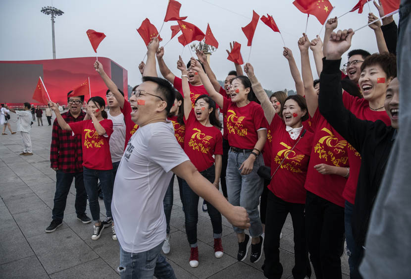 Tourists gather for a photo while visiting Tiananmen Square in Beijing for National Day celebrations, Sept. 27, 2019. Kevin Frayer/Getty Images/VCG