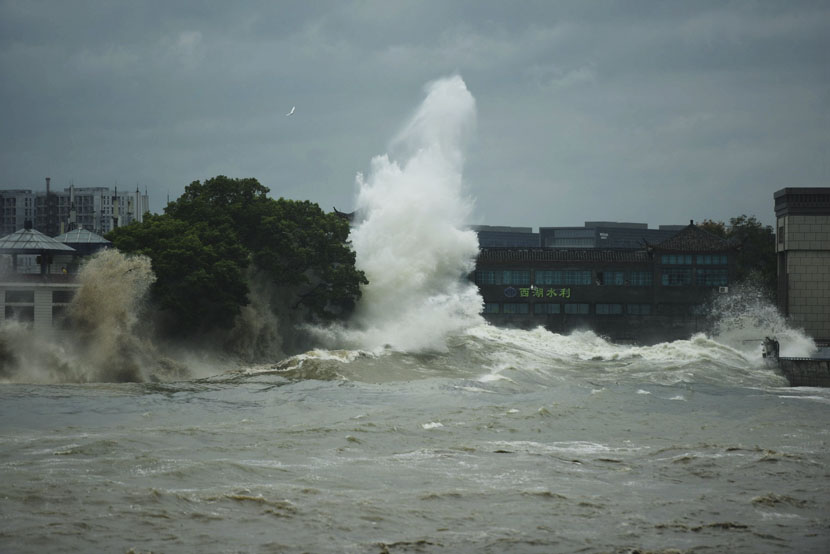 A storm surge caused by Typhoon Mitag overflows the banks of the Qiantang River in Hangzhou, Zhejiang province, Oct. 1, 2019. Long Wei/IC