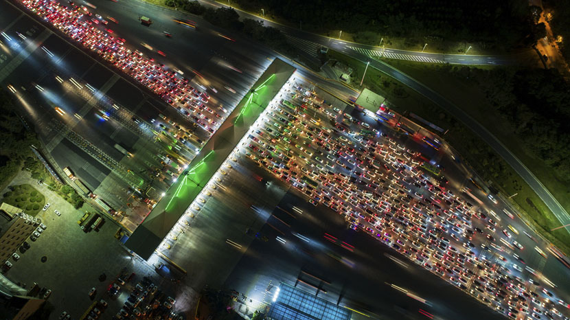 An aerial view shows a traffic jam near a toll station in Nanjing, Jiangsu province, Sept. 30, 2019. Costfoto/Barcroft Media/VCG
