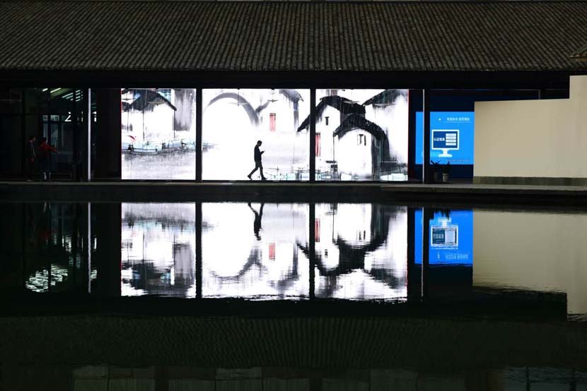 A man walks through the halls of the Wuzhen International Internet Exhibition & Convention Center during the 6th World Internet Conference in Wuzhen, Zhejiang povince, Oct. 21, 2019. Li Jianming/VCG