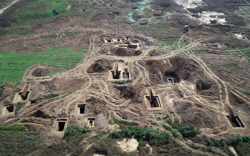 An aerial view of 136 tombs of the Chu State in the Eastern Zhou Dynasty at an archaeological evacuation site in Xiangyang, Hubei province, Oct, 30, 2019. Over 400 cultural relics, including bronze and jade ware, were found during the excavation. VCG