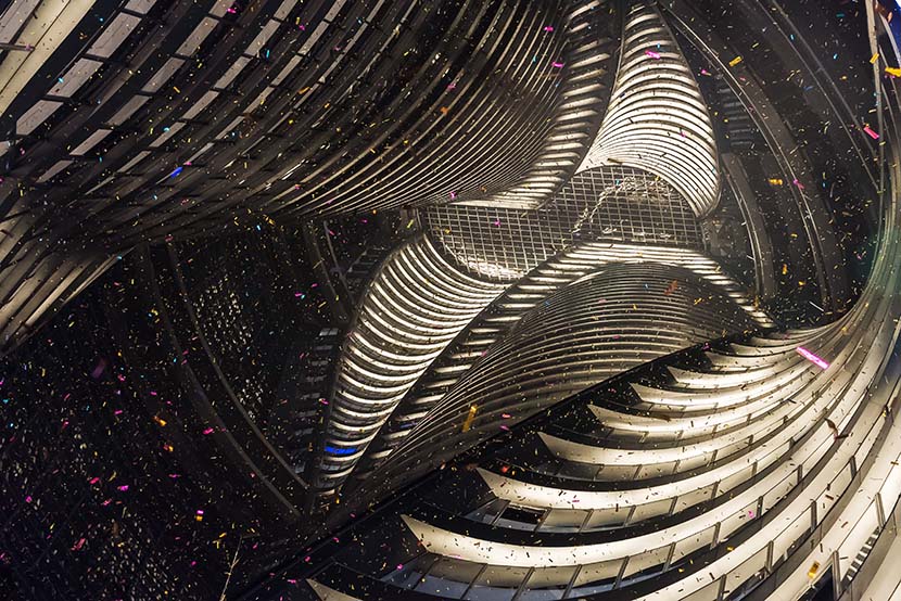 The interior of the Leeza Soho tower during its grand opening in Beijing, Nov. 19, 2019. Leeza Soho was designed by Zaha Hadid Architects and is a 46-story mixed-use tower with the world’s tallest atrium. VCG