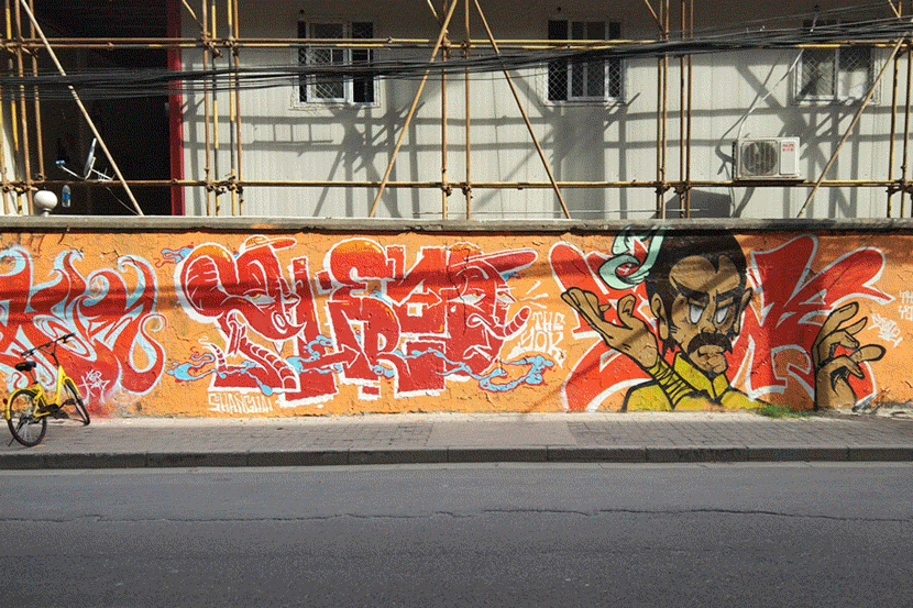 A GIF shows graffiti on Moganshan Road from 2010 to 2019. Kenrick Davis/Sixth Tone