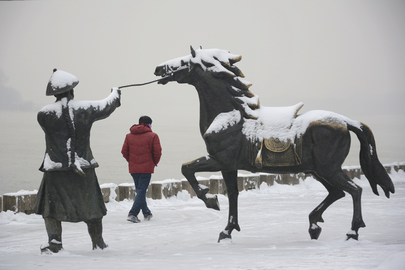 A man walks through the snow in Jilin, Jilin province, Dec. 11, 2019.