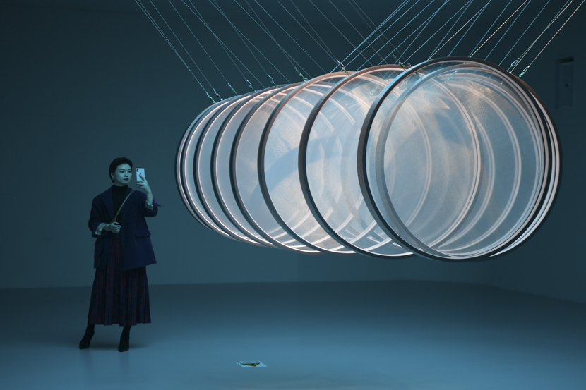 A woman takes photos of an art installation during the “MOTSE in MICA” exhibition in Changsha, Hunan province, Dec. 12, 2019. Xue Yuge/Xinhua