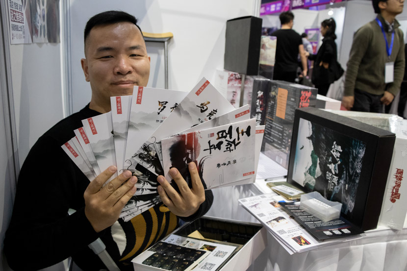 Wang Zhe shows his box set games at the International Mystery Game Expo in Shanghai, Nov. 14, 2019. Kenrick Davis/Sixth Tone