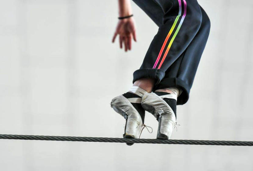 A girl practices walking along a tightrope at a traditional arts school in Yengisar County, Xinjiang Uyghur Autonomous Region, Dec. 17, 2019. Liu Xin/CNS
