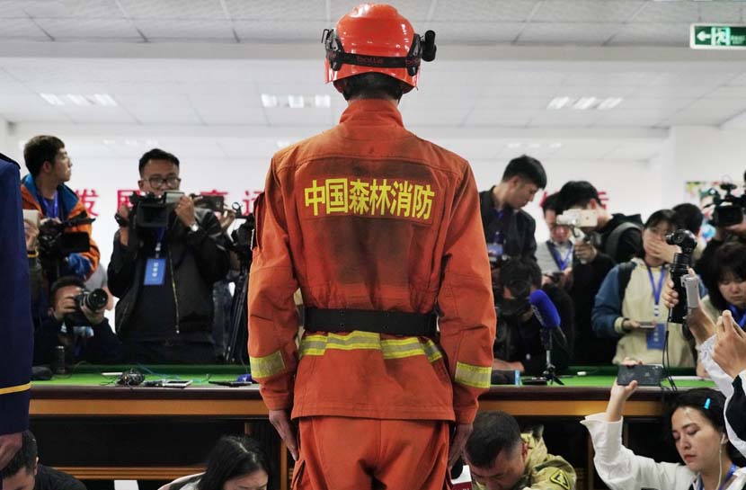 A surviving firefighter attends a press conference after a deadly forest fire killed 27 firefighters and three people from the local fire department in Muli County, Liangshan Yi Autonomous Prefecture, Sichuan province, April 3, 2019. IC
